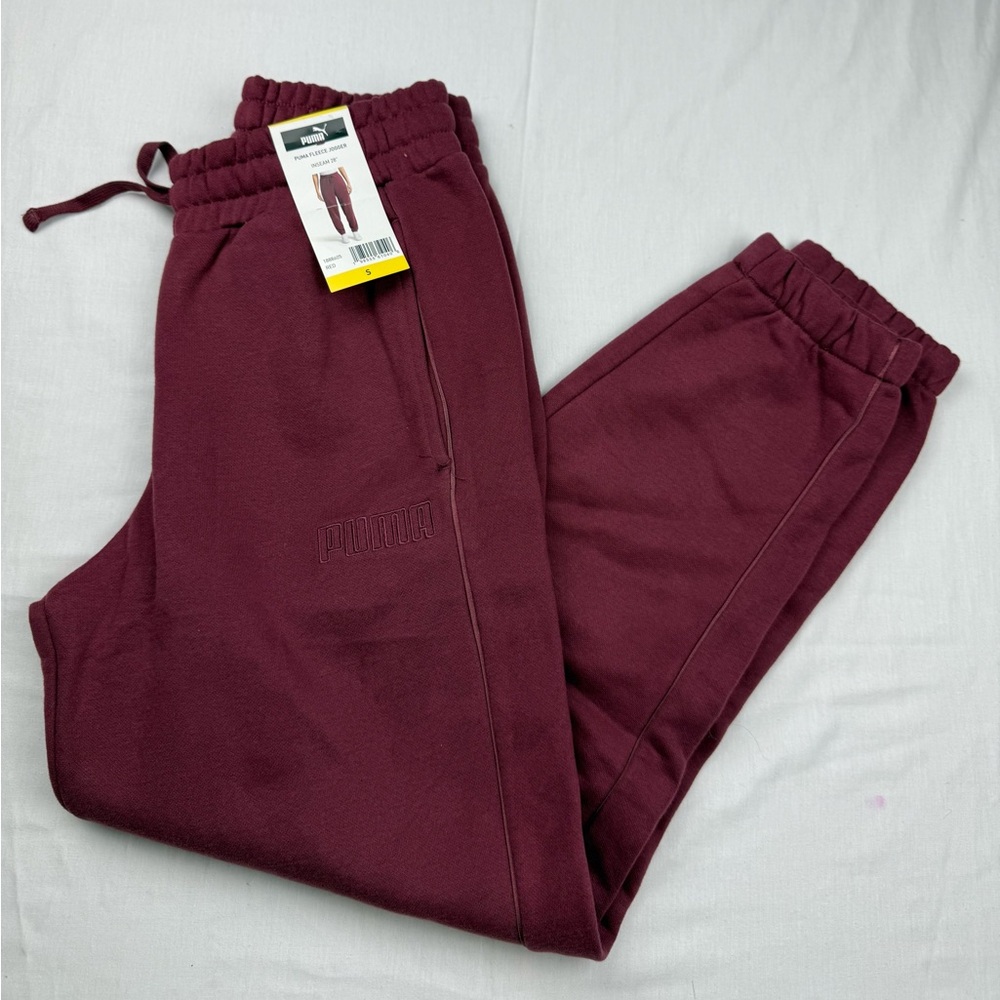 Puma women’s Maroon Fleece Joggers pants New size small Light mark